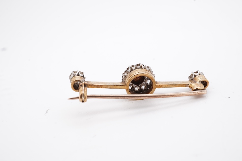 An early to mid 20th century yellow metal, split pearl and diamond cluster set bar brooch, 37mm, gross weight 4.3 grams. Condition - fair